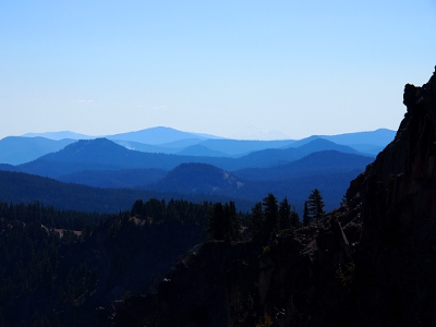 [Dark mountain range with each successive range a lighter, smoked blue as they fade into the distance. At least five distinct layers visible in the photo.]